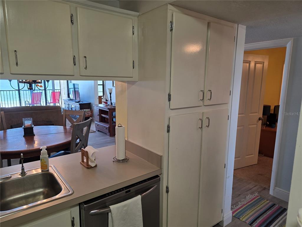 17580 Gulf Boulevard, Unit 311 Redington Shores, FL 33708 - Photo 29 of 34 a kitchen with a sink cabinets and appliances