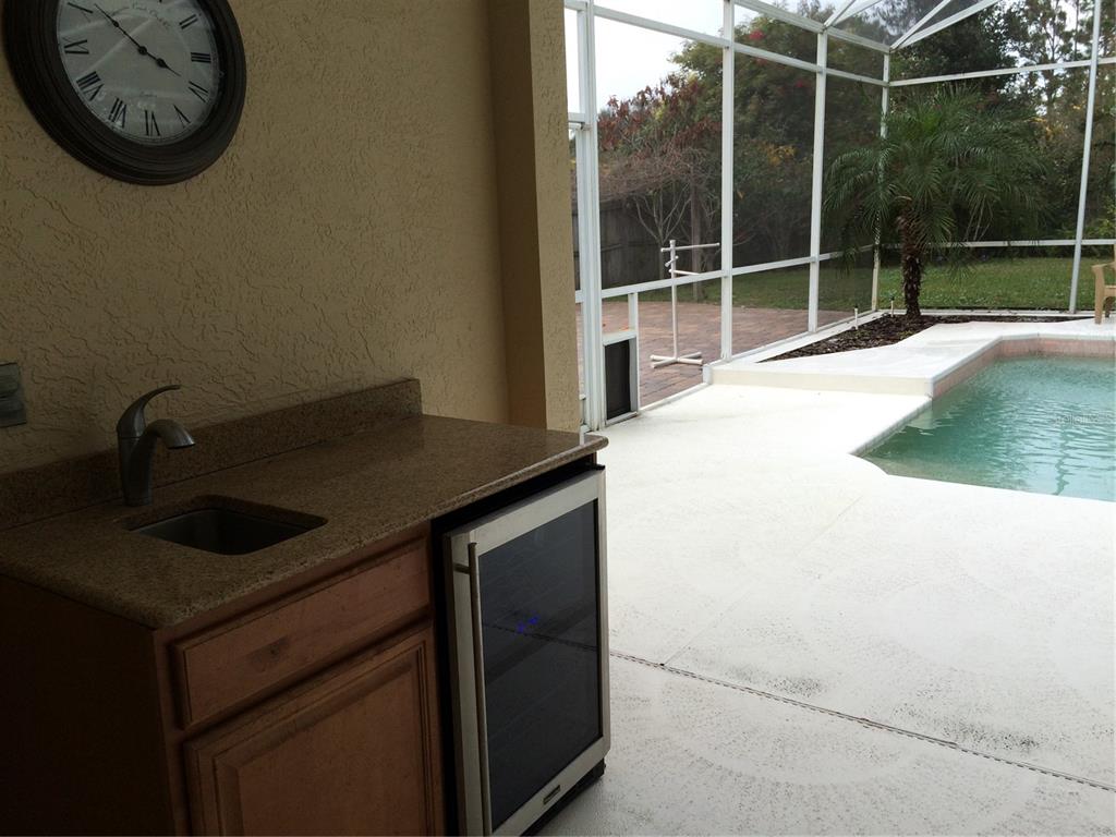 8125 Courtleigh Drive Orlando, FL 32835 - Photo 23 of 26 a bathroom with a sink and a mirror