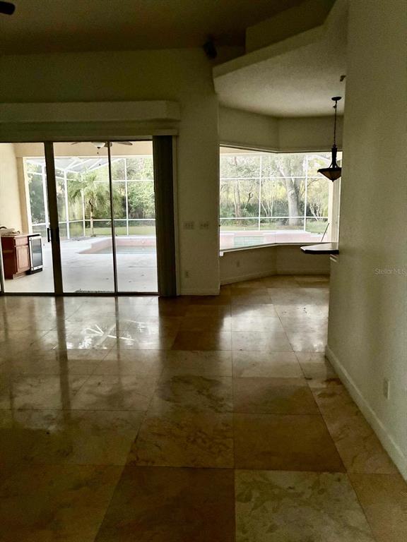 8125 Courtleigh Drive Orlando, FL 32835 - Photo 8 of 26 a view of a room with large windows