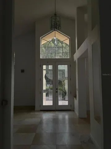 a view of dining room with wooden floor and windows