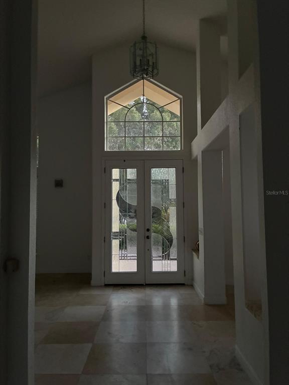 8125 Courtleigh Drive Orlando, FL 32835 - Photo 9 of 26 a view of dining room with wooden floor and windows