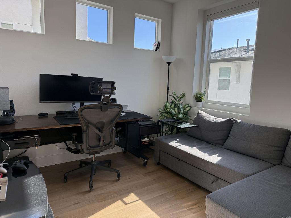10431 Newbliss Way San Diego, CA 92126 - Photo 6 of 7 a living room with furniture rug and a window