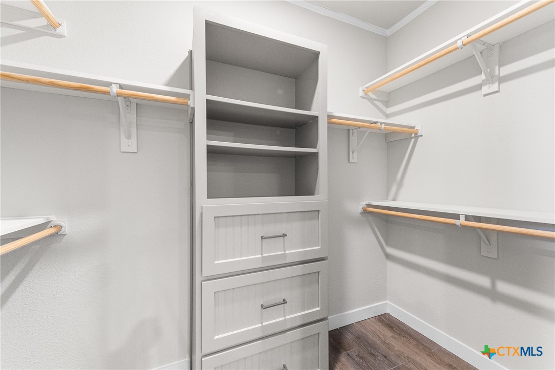9130 Rebecca Creek Road Spring Branch, TX 78070 - Photo 19 of 41 a view of walk in closet with empty racks