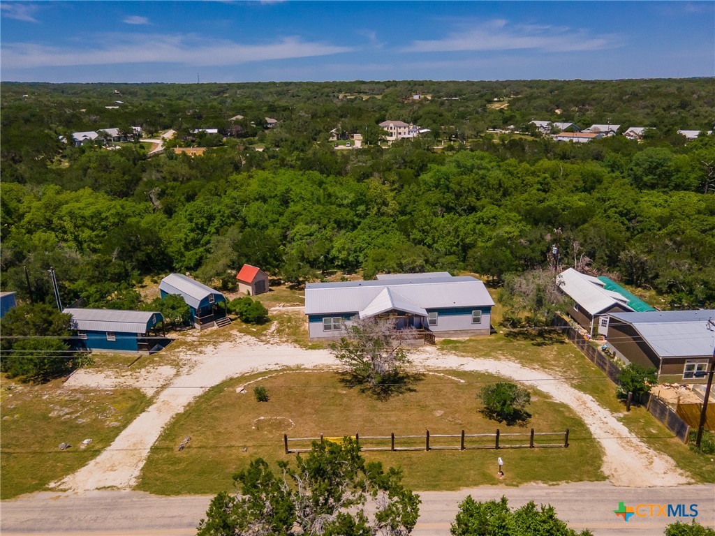 9130 Rebecca Creek Road Spring Branch, TX 78070 - Photo 2 of 41 an aerial view of residential houses with outdoor space