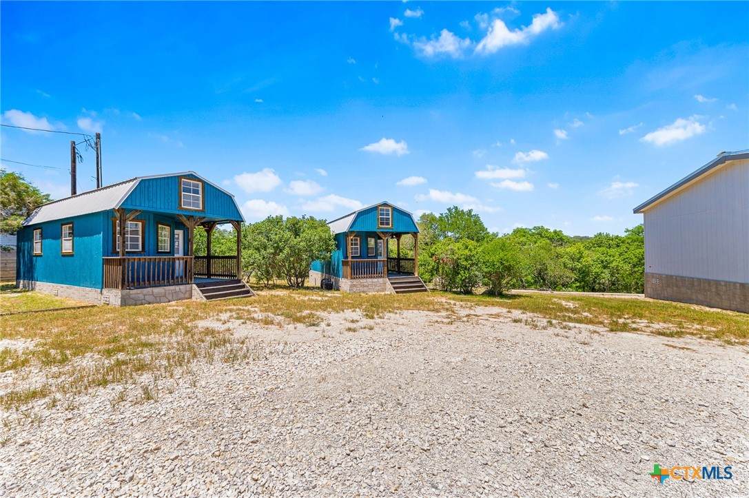 9130 Rebecca Creek Road Spring Branch, TX 78070 - Photo 33 of 41 a front view of a house with a yard