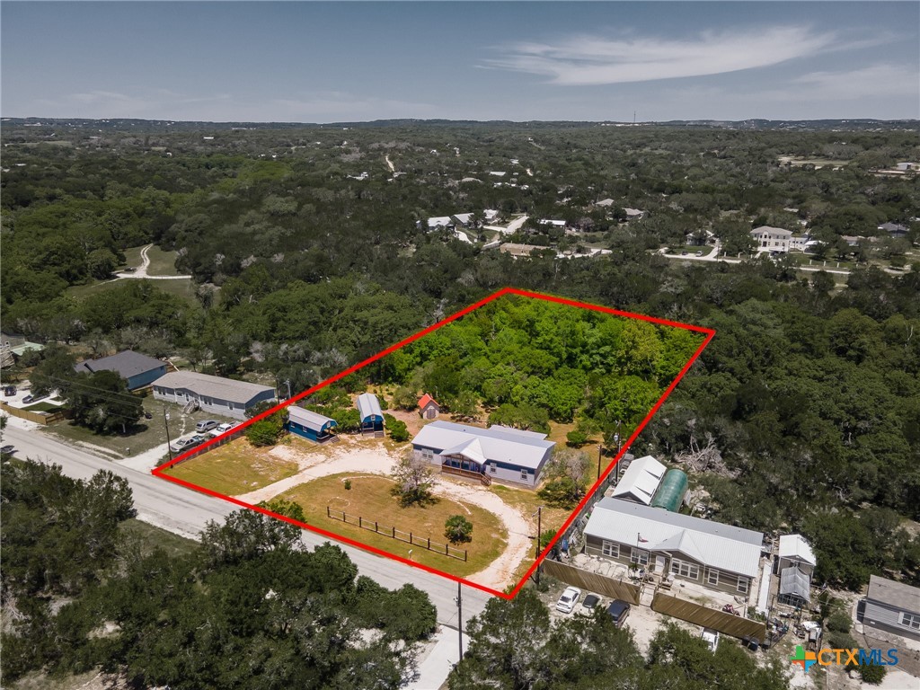 9130 Rebecca Creek Road Spring Branch, TX 78070 - Photo 39 of 41 an aerial view of residential houses with outdoor space and ocean view