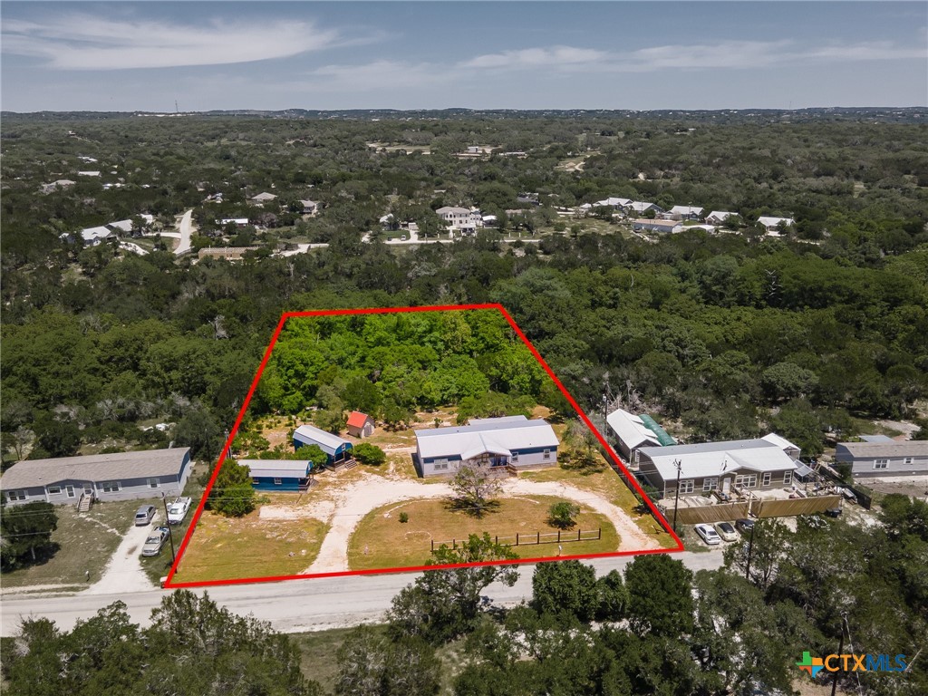 9130 Rebecca Creek Road Spring Branch, TX 78070 - Photo 40 of 41 an aerial view of residential houses with outdoor space