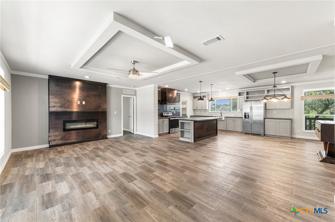 9130 Rebecca Creek Road Spring Branch, TX 78070 - Photo 5 of 41 a view of kitchen with refrigerator and microwave