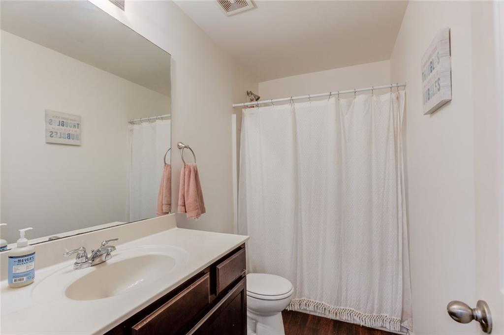 331 Merigold Way Pendergrass, GA 30567 - Photo 22 of 39 a bathroom with a sink toilet and shower