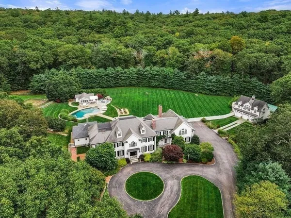 an aerial view of a house with outdoor space pool patio and outdoor seating