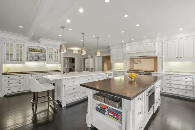 a kitchen with stainless steel appliances granite countertop a stove and a sink