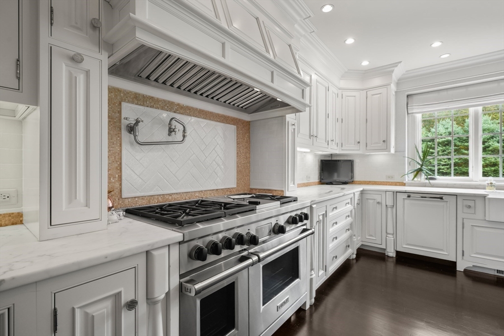 8 Hamlins Crossing East Dover, MA 02030 - Photo 14 of 42 a kitchen with granite countertop a stove sink and cabinets