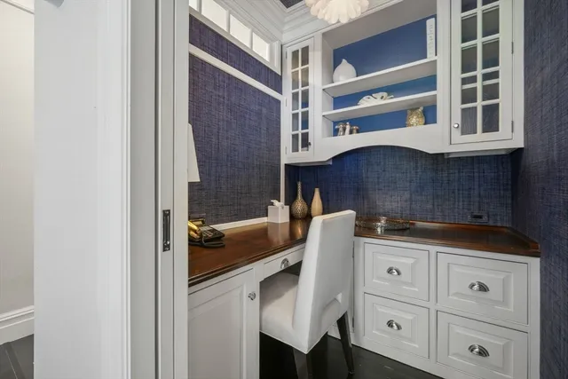 a kitchen with a cabinets and chandelier