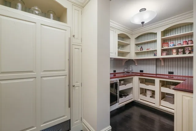 a view of kitchen with cabinets and wooden floor
