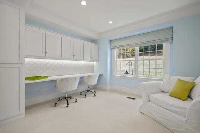 a workspace with a couch and a window