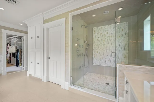 a bathroom with a shower and a sink