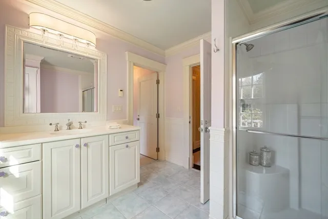 a bathroom with a double vanity sink and mirror