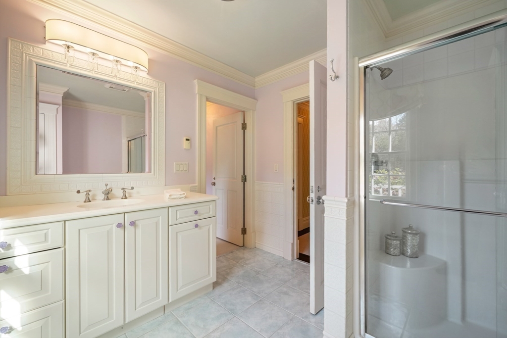 8 Hamlins Crossing East Dover, MA 02030 - Photo 35 of 42 a bathroom with a double vanity sink and mirror