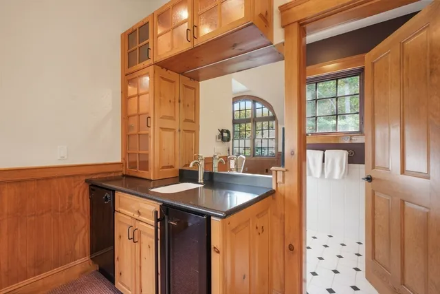 a kitchen with stainless steel appliances granite countertop a sink and a window
