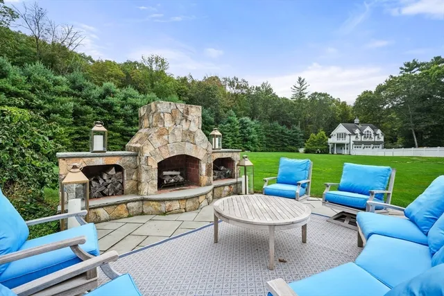 a view of a patio with a table and chairs
