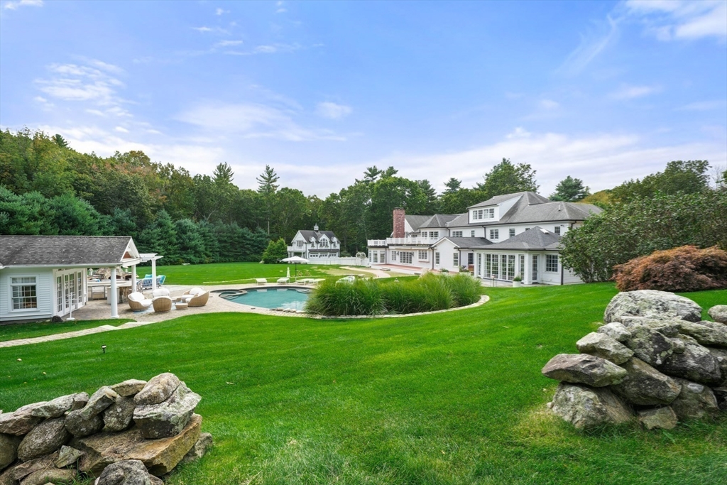 8 Hamlins Crossing East Dover, MA 02030 - Photo 41 of 42 a view of a house with a backyard and a garden