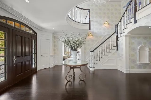 a view of entryway with wooden floor
