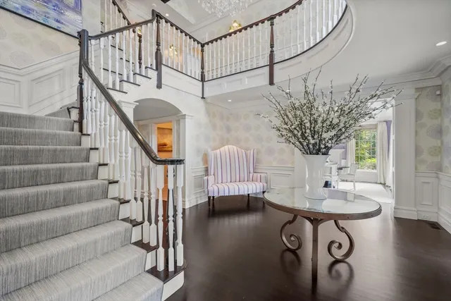 a view of entryway livingroom and hall with wooden floor