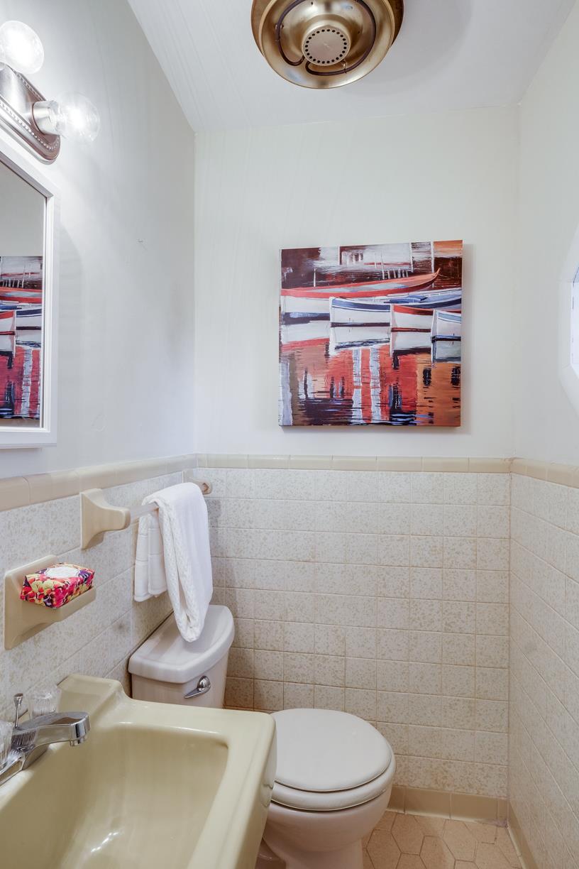 1808 Hygeia Road Greenbrier, TN 37073 - Photo 8 of 12 a bathroom with a sink a toilet and a mirror