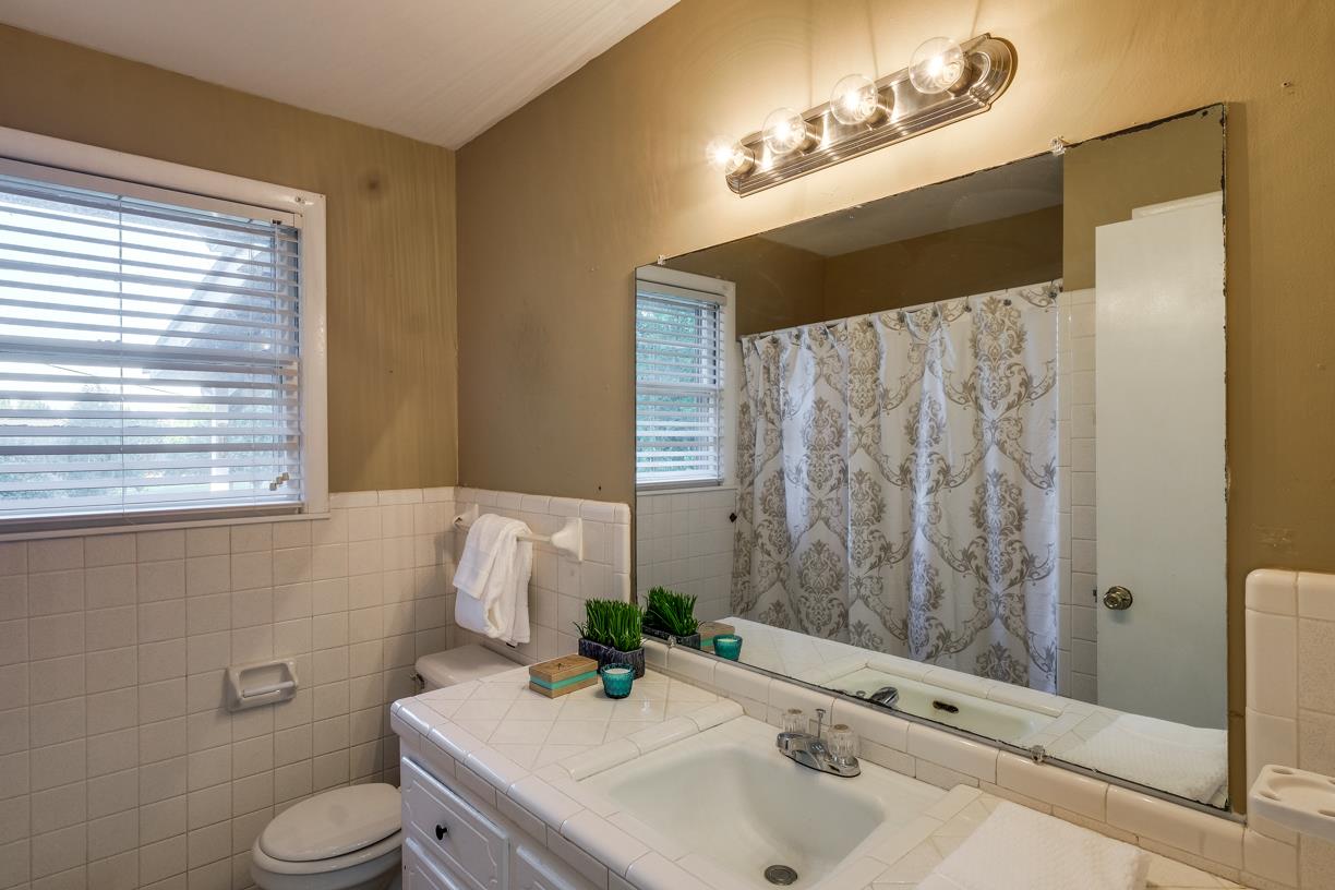 1808 Hygeia Road Greenbrier, TN 37073 - Photo 10 of 12 a bathroom with a sink and a mirror