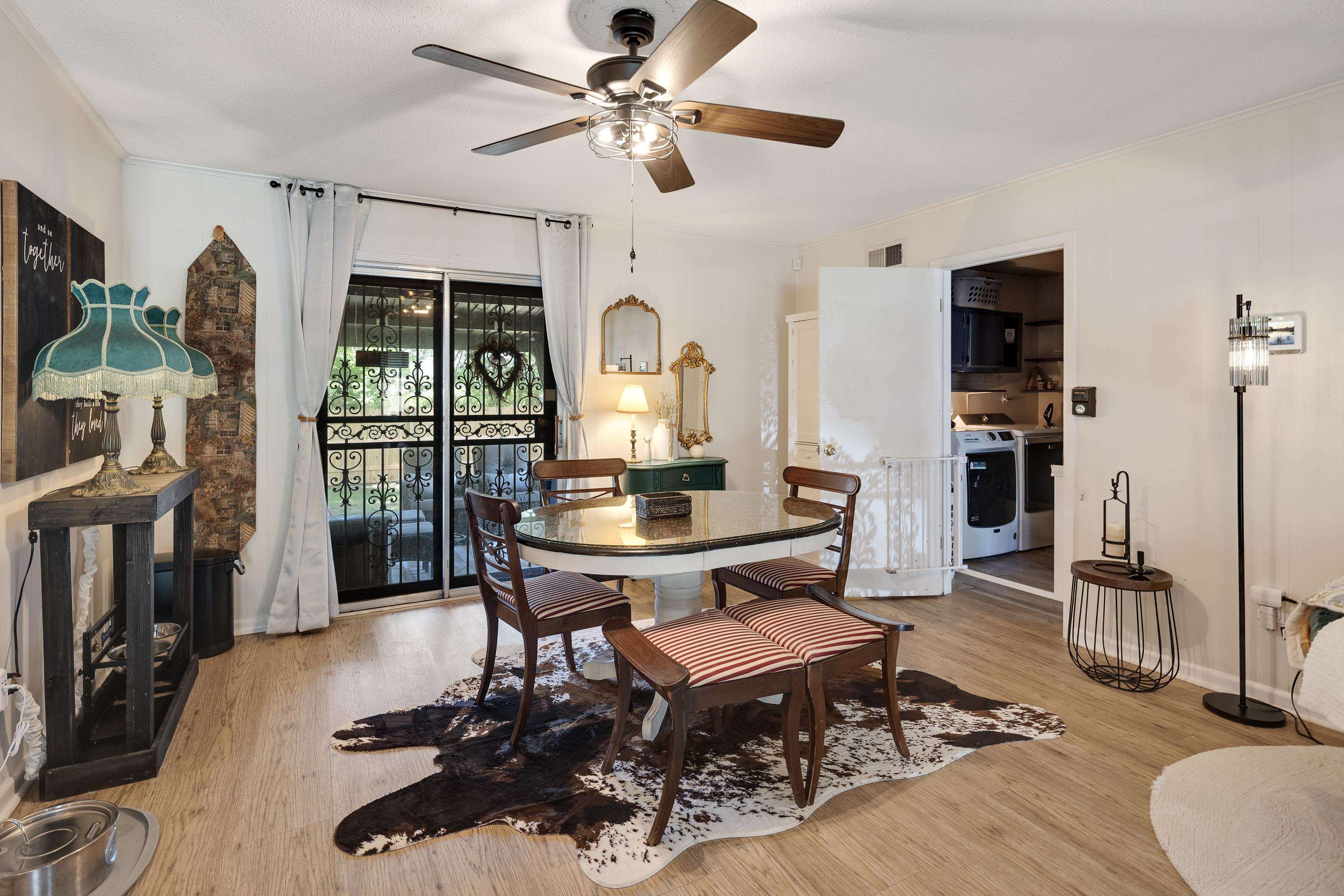 1137 Greenview Road Collierville, TN 38017 - Photo 10 of 35 a living room with furniture a flat screen tv and a table