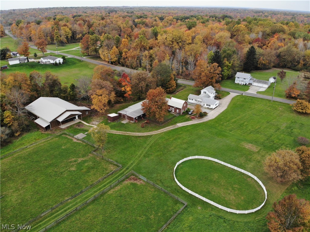 7706 Sanborn Road Ashtabula, OH 44004 - Photo 2 of 35 Located on 14+ acres with house, caretakers house, 4-car garage, 12-stall horse barn, indoor riding arena, outdoor riding arena, shed, pond and creek