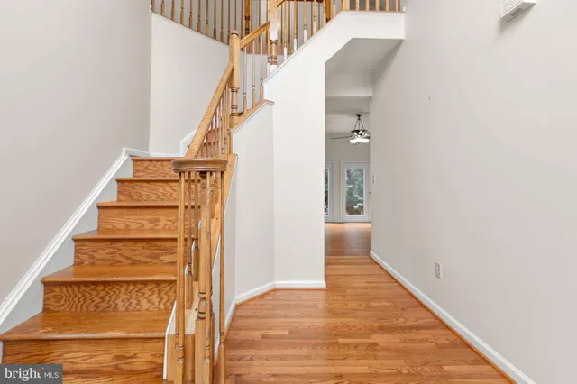a white toilet sitting next to a bath tub