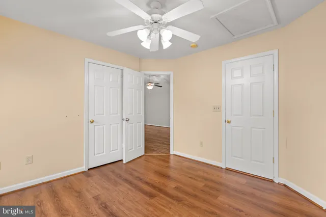 a view of a livingroom with wooden floor and a flat screen tv