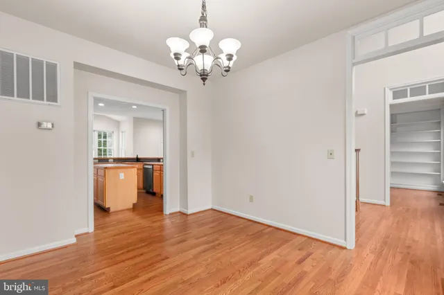 a kitchen with stainless steel appliances granite countertop a stove and a refrigerator