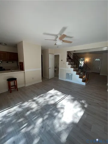 a view of livingroom with kitchen and furniture