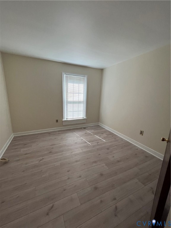 804 Nantucket Court Richmond, VA 23235 - Photo 9 of 12 wooden floor in an empty room with a window