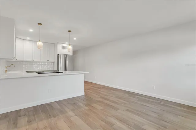 a view of kitchen with wooden floor
