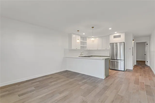a view of kitchen with wooden floor