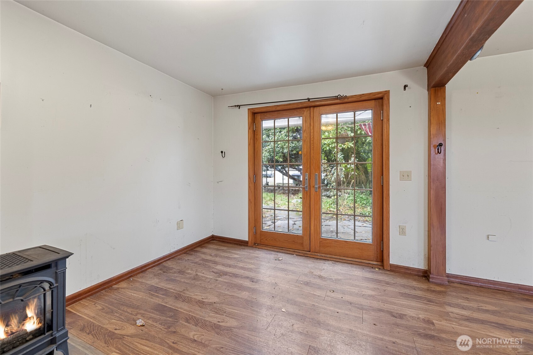 17662 Dunbar Road Mount Vernon, WA 98273 - Photo 7 of 18 a view of an empty room with wooden floor and a window