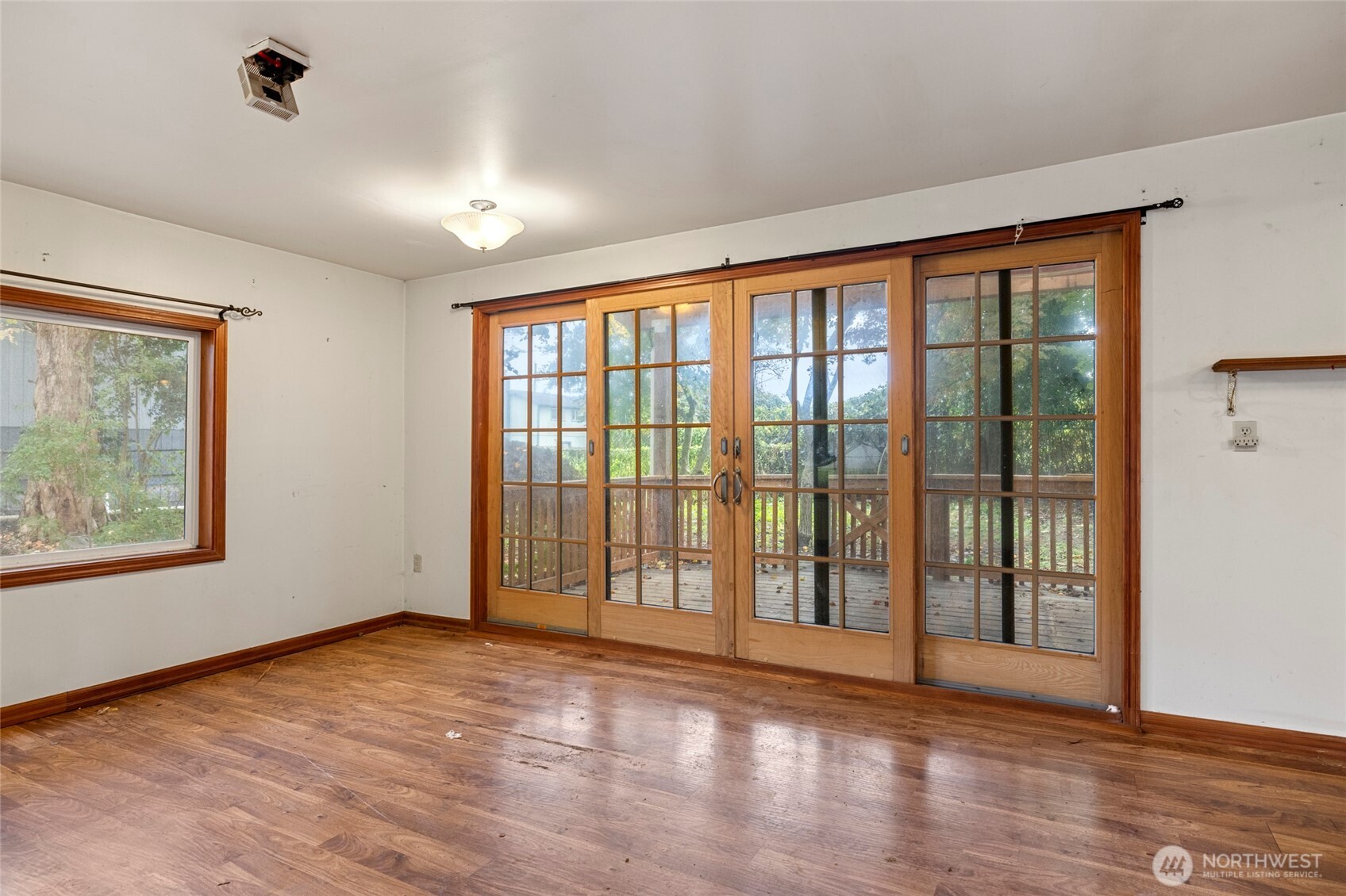 17662 Dunbar Road Mount Vernon, WA 98273 - Photo 8 of 18 a view of an empty room with wooden floor and a window