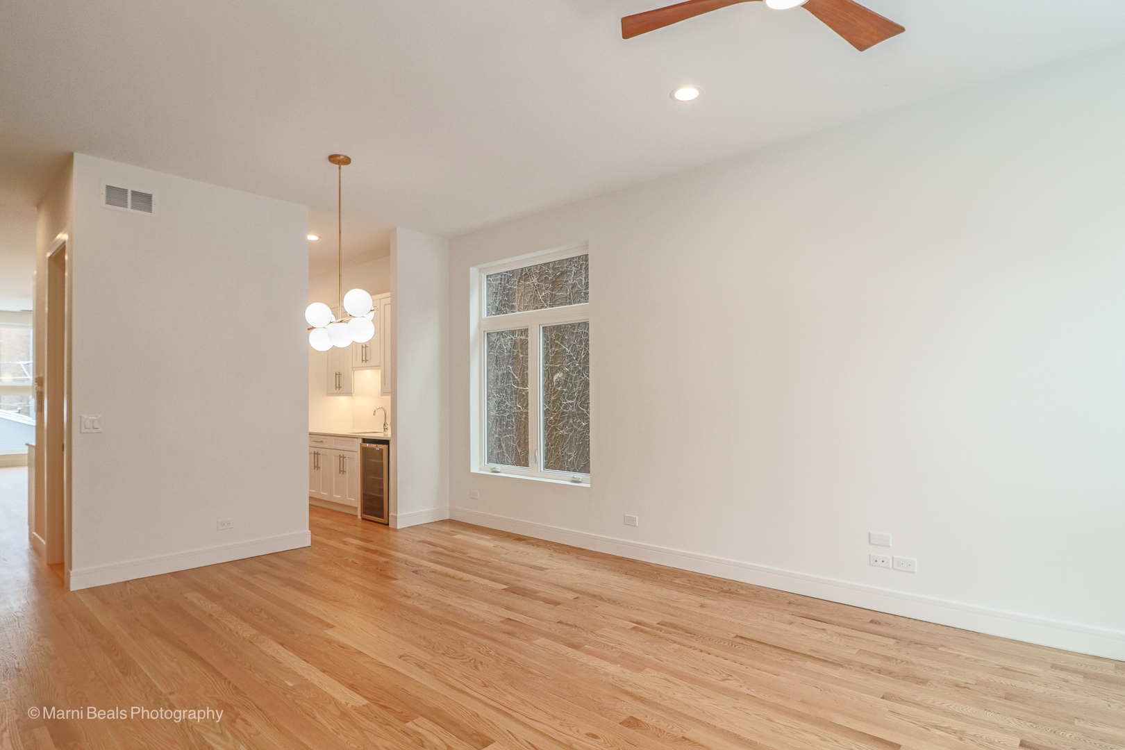 6123 South Ellis Avenue Chicago, IL 60637 - Photo 12 of 31 a view of empty room with wooden floor and fan