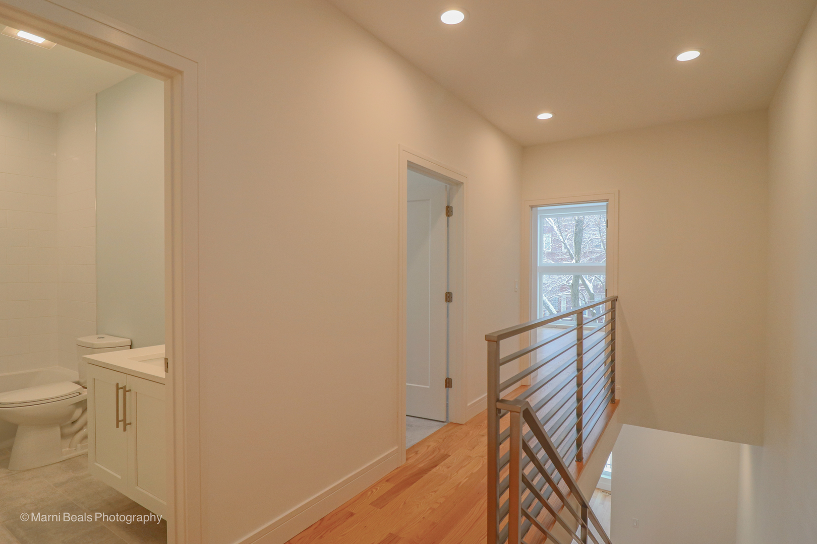 6123 South Ellis Avenue Chicago, IL 60637 - Photo 15 of 31 a view of a hallway with wooden floor and a bathroom