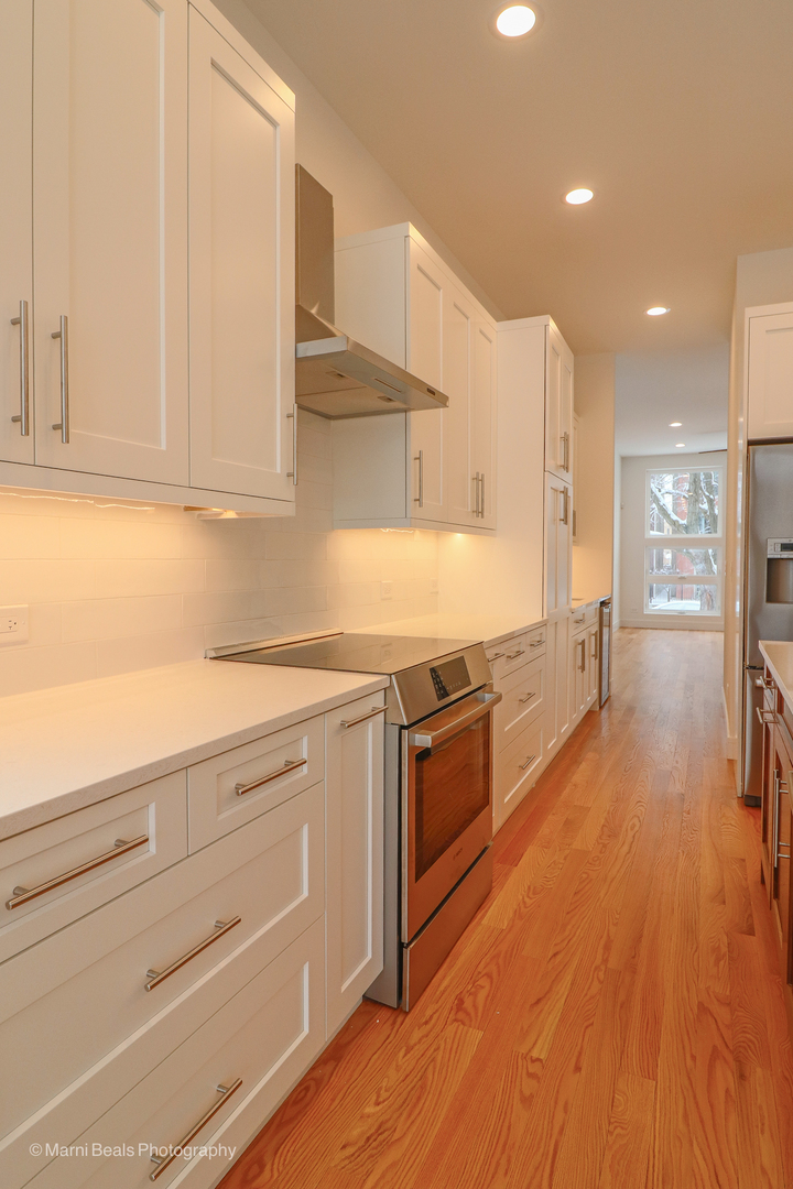 6123 South Ellis Avenue Chicago, IL 60637 - Photo 3 of 31 a kitchen with stainless steel appliances granite countertop a stove and a sink