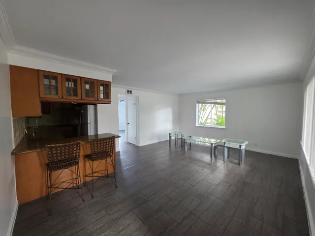 a view of a livingroom with furniture and a flat screen tv