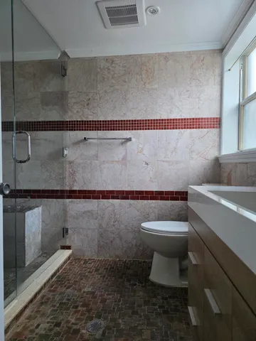 a bathroom with a toilet and a sink