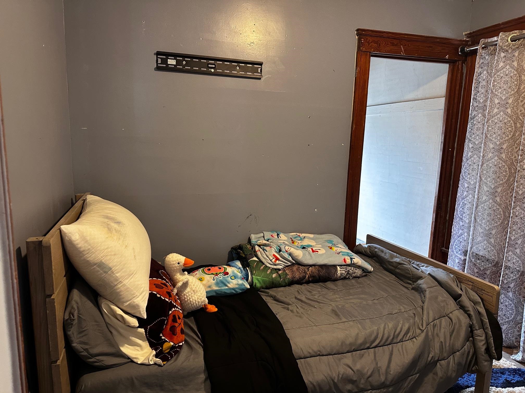 482 South Float Avenue Freeport, IL 61032 - Photo 13 of 17 a bedroom with a bed and a mirror