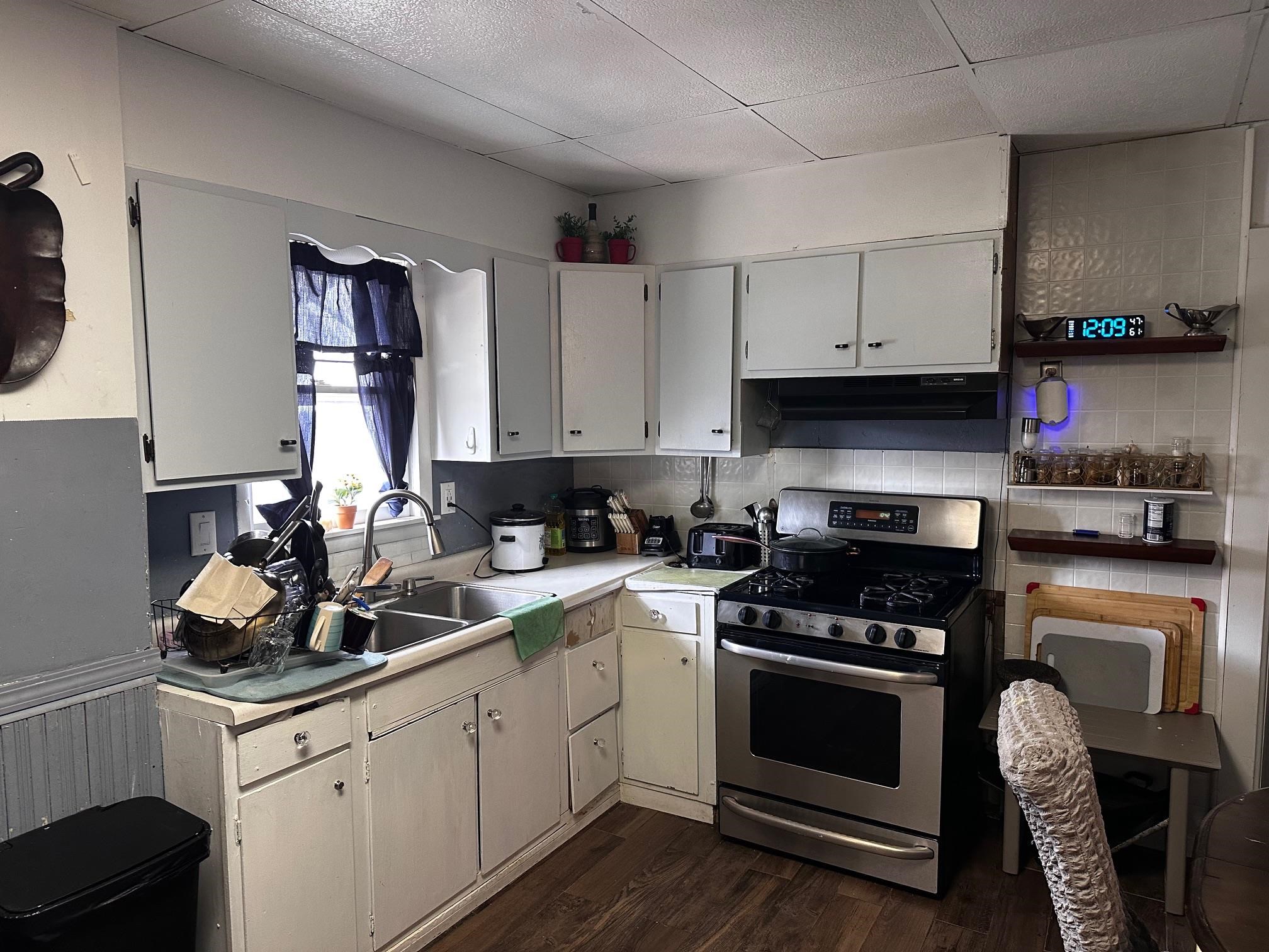 482 South Float Avenue Freeport, IL 61032 - Photo 7 of 17 a kitchen with cabinets a sink and appliances