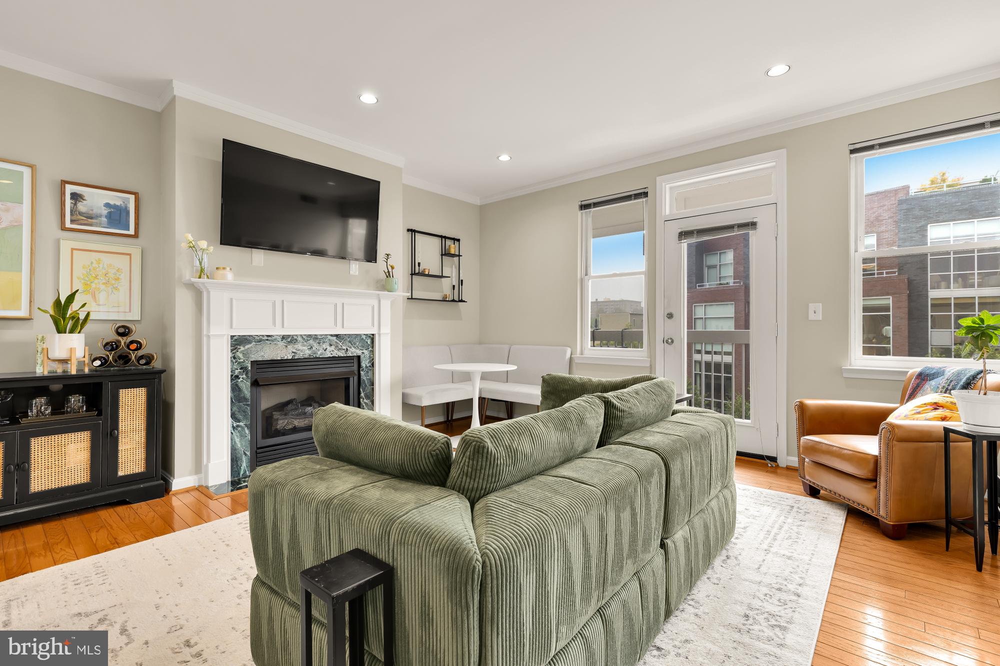 2004 11th Street Northwest, Unit 436 Washington, DC 20001 - Photo 1 of 15 a living room with furniture fireplace and flat screen tv