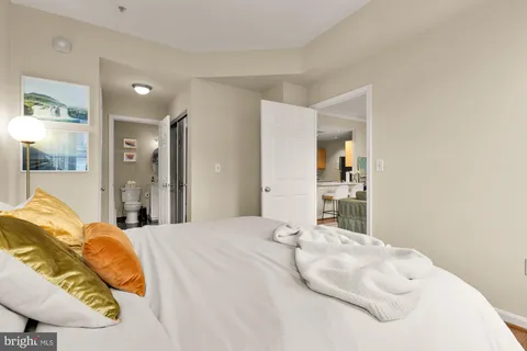 a large white bed in a white room