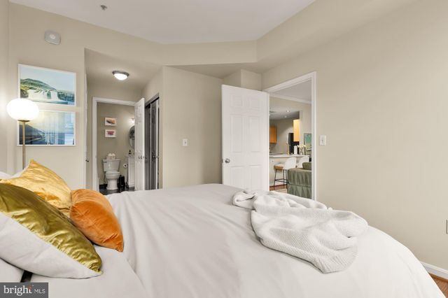 a large white bed in a white room